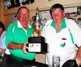 The Beaver team captains, Larry and Dennis Willett, pose with the annual challenge trophy.